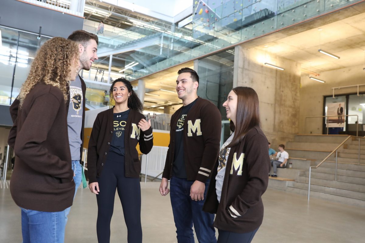A group of bisons student-athletes in the Active Living Centre Agora chatting