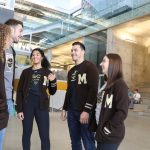 A group of bisons student-athletes in the Active Living Centre Agora chatting