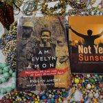 This image shows Grace and Evelyn's books lying on hand-made gifts they made to raise money for LRA escapees.