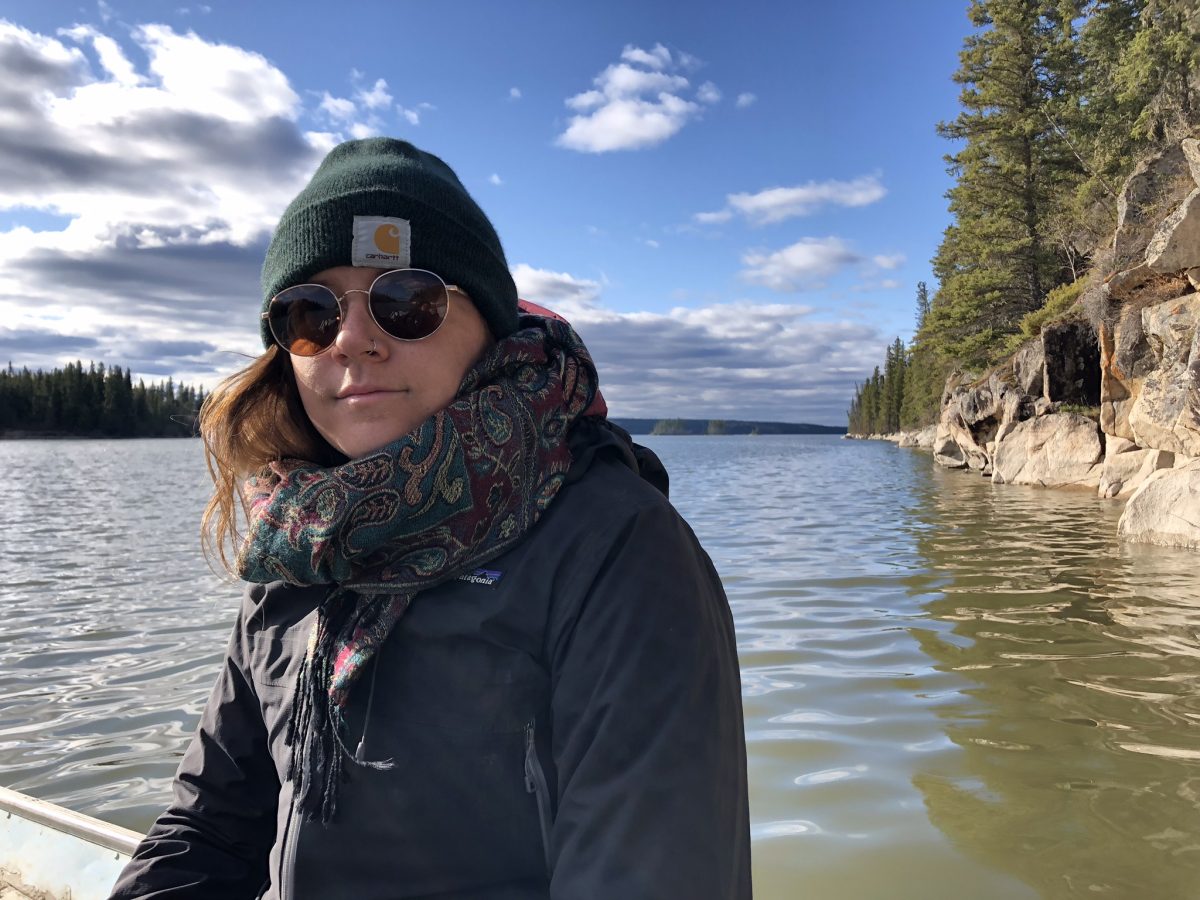 A photo of Braydn Matheson on a boat in a lake at Leaf Rapids, Manitoba.