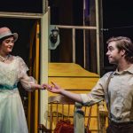 Two actors holding hands on stage during a production of Look Homeward, Angel.