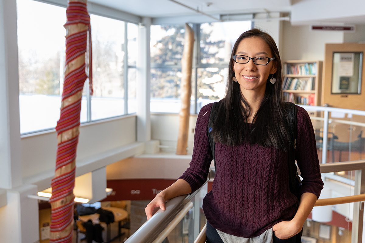 Anita Murdock stands inside Migizii Agamik - Bald Eagle Lodge