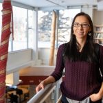 Anita Murdock stands inside Migizii Agamik - Bald Eagle Lodge