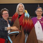 Brenda Lafreniere receives a star blanket at the Indigenous Awards of Excellence.