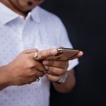 A person works on his phone