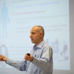 professor-presenting-in-front-of-screen