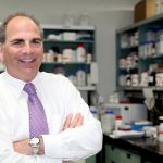 Dr. Lorrie Kirshenbaum in his research lab