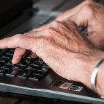 Hands on a computer keyboard