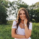 Chauntel Dyck standing in a field.