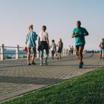 People jogging and walking on a path.