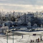 playgorund, town houses and parking lot in the winter