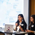 Indigenous architecture student Reanna Merasty and colleague presenting in front of a power point.