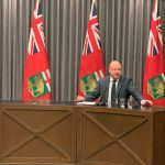 Dr. Brent Roussin at a desk