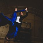 Horace Luong and Sophie Sickert perform a ballroom dance in formal clothing.