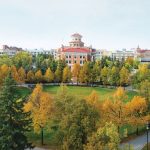 Overlooking the quad on Fort Garry campus, with tree leaves changing to orange in autumn.