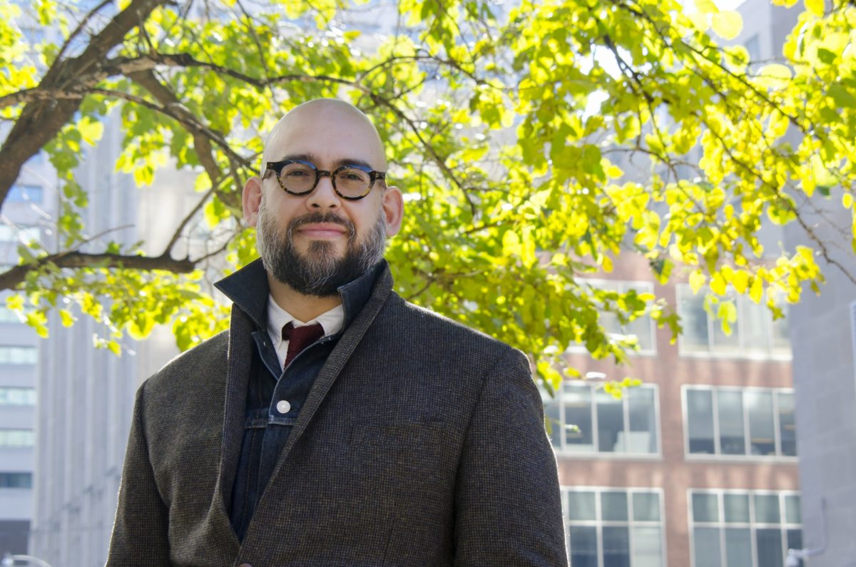 UM alumnus Dr. Carlos Quinonez stands outside at the University of Toronto, where he is a faculty member.