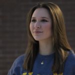 U of M student looking off into distance.