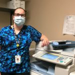 Dr. Allison Paige stands beside the fax machine at Kildonan Medical Centre.
