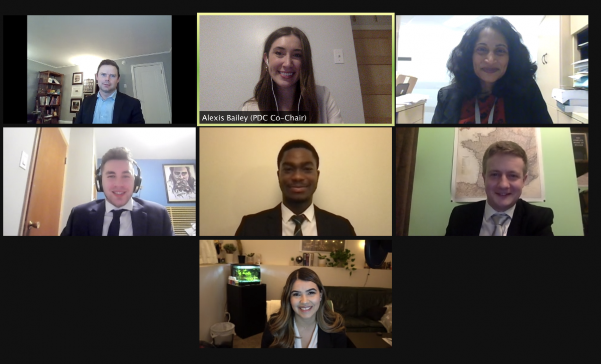 Zoom call computer screen of law students and mentor lawyers.