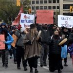 Anti-poverty protesters march in downtown Winnipeg in 2018. Andrew Tod/Manitoba Federation of Labour, Author provided