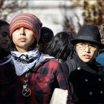 People standing together. (Shutterstock)