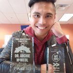 Nolan De Leon with 2 trophies