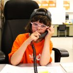 Mini U participant on the phone