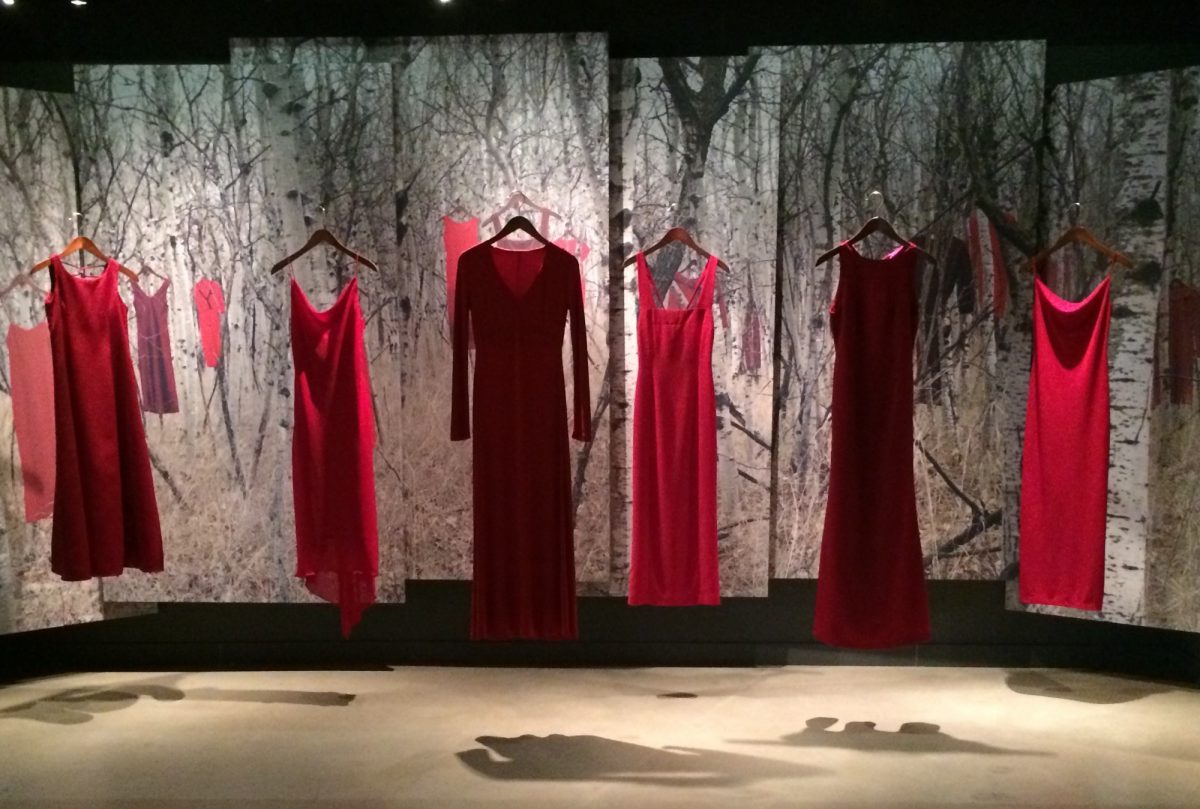 Red dresses hanging on display