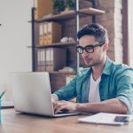 Professional looks at his computer