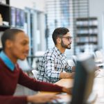 People working on computers looking at their screens