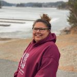 Photo of law student Daphne Comegan at her family home in Treaty 3 territory.