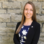 Lauren Slegers standing in front of a brick wall.