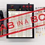 The text "Lab in a Box" overlaid on top of a collection of items.