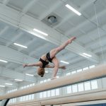 Gril on balance beam