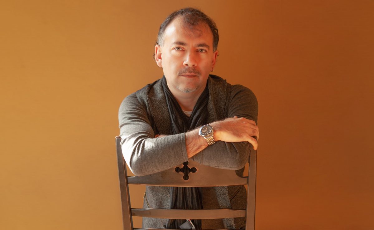 Rod Lastra on a chair