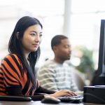 Student at desktop computer in lab