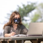 student-looking-at-laptop