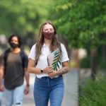 Students in masks walking on the Fort Garry campus