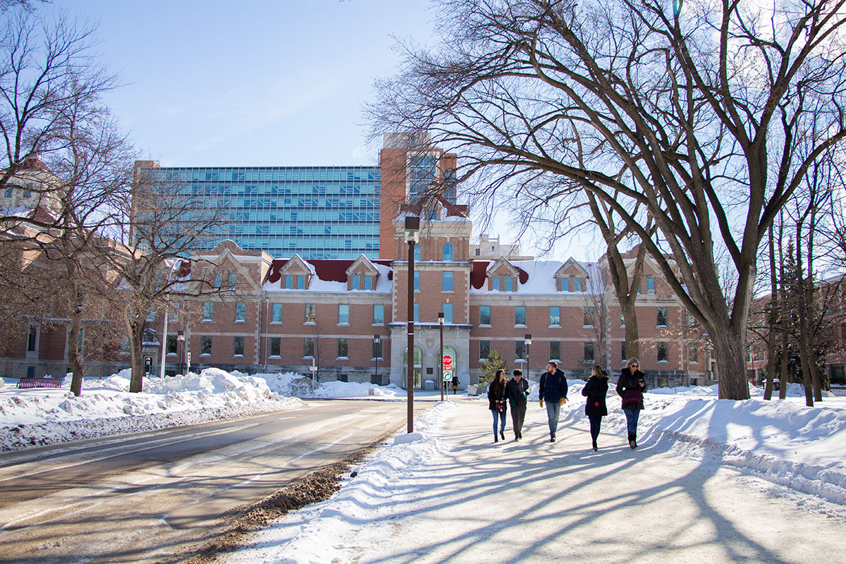 Students walk on Fort Garry campus in winter