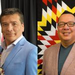 Tim Daniels and Whelan Sutherland, Treaty One Development Corporation, smiling in suits.