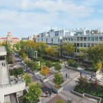 An aerial look of Fort Garry campus buildings and people walking on walkways.