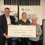 Tom Malkiewicz, Chelsea Ruth an Bev Ruth hold a novelty cheque for $10,000