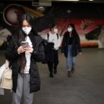Students in masks walking in the tunnels \\ Photo by Mike Latschislaw