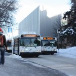 UM campus members walking to catch a bus at Fort Garry.