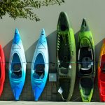 Row of different coloured kayas