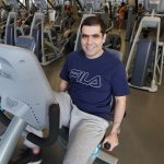 Saman Sobhani sits on a workout bike