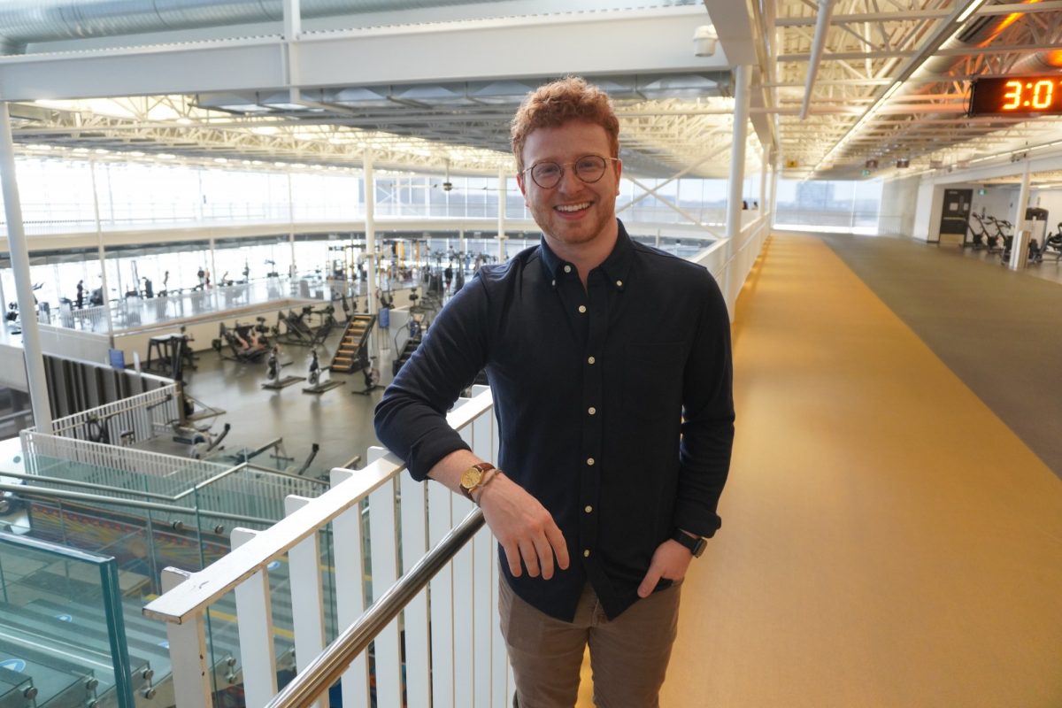 Jaron stands in ALC smiling