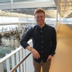 Jaron stands in ALC smiling