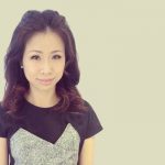 Lily Lim in front of a neutral background