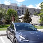 Electric vehicle parked and charging in B lot.